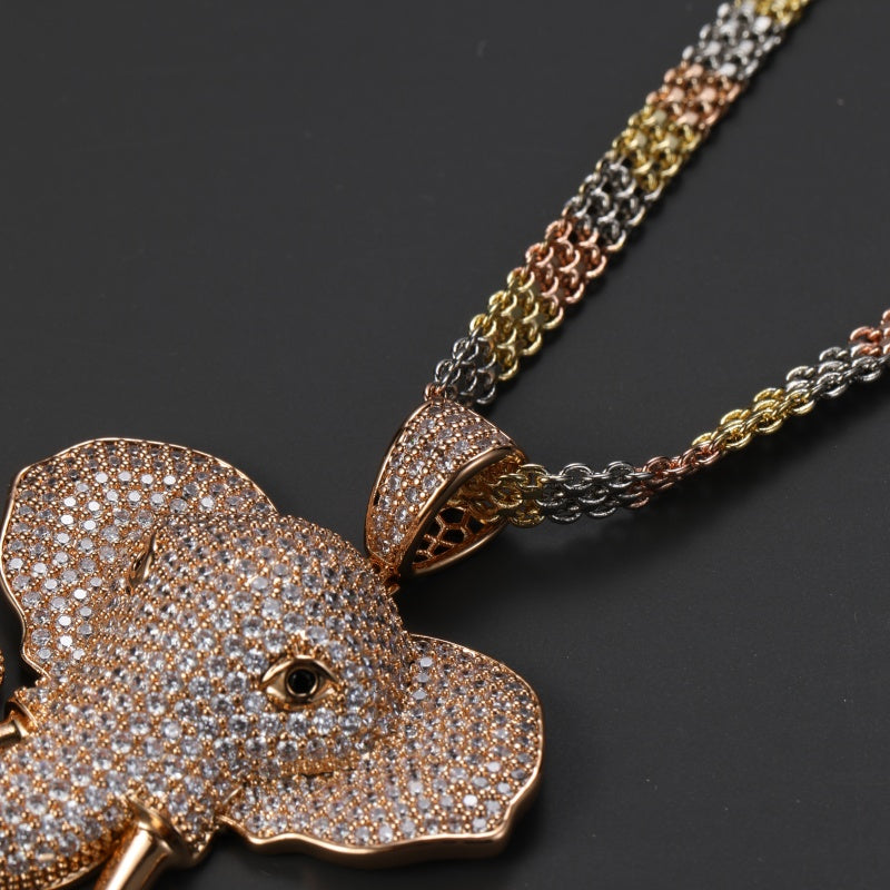 RoundLiving Diamond-Studded Gold Elephant Pendant Necklace.